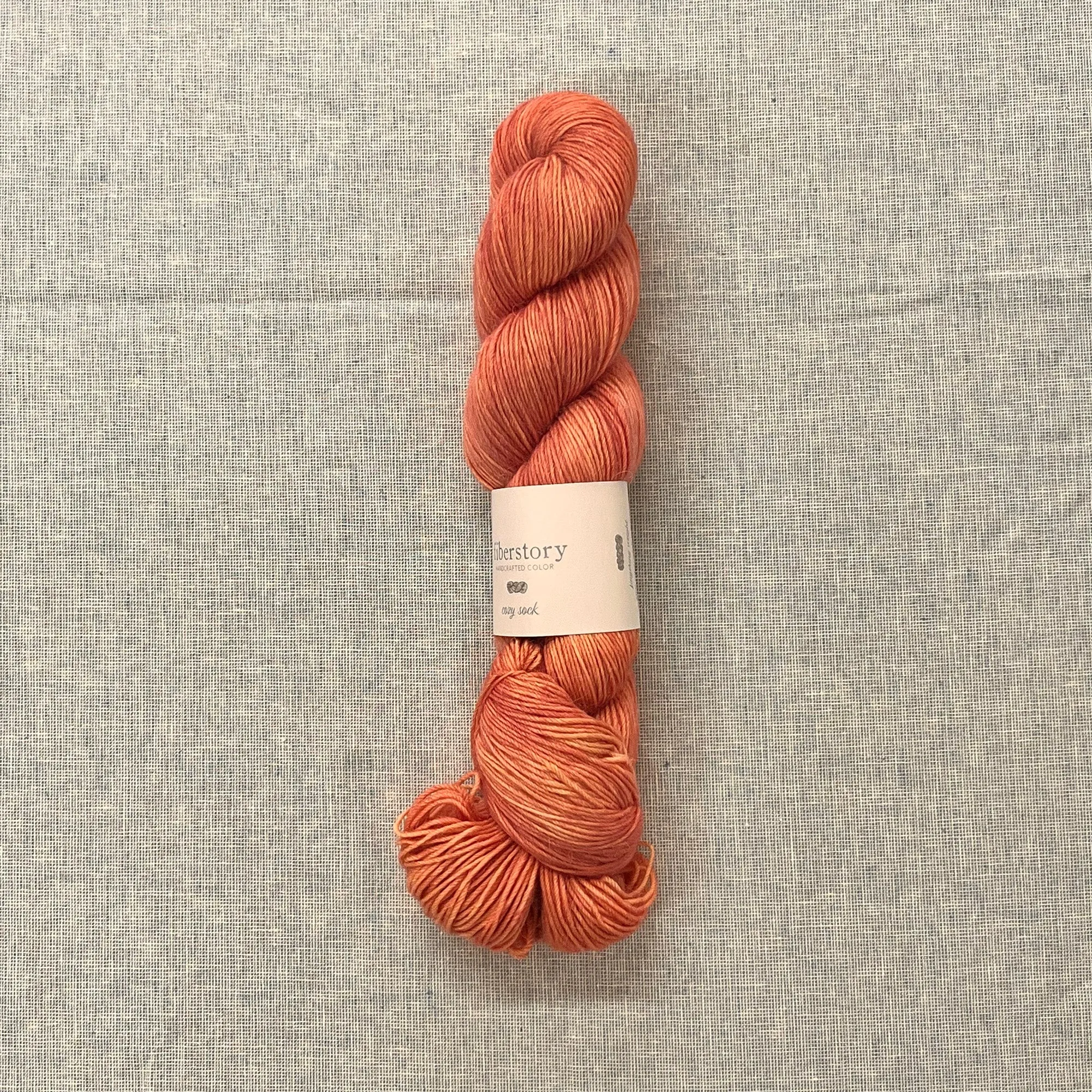 Here is an optimized title for the e-commerce product:

Luxurious Fiberstory Cozy Sock Yarn - Soft, Durable, Hand-Dyed Wool Blend for Knitting & Crochet