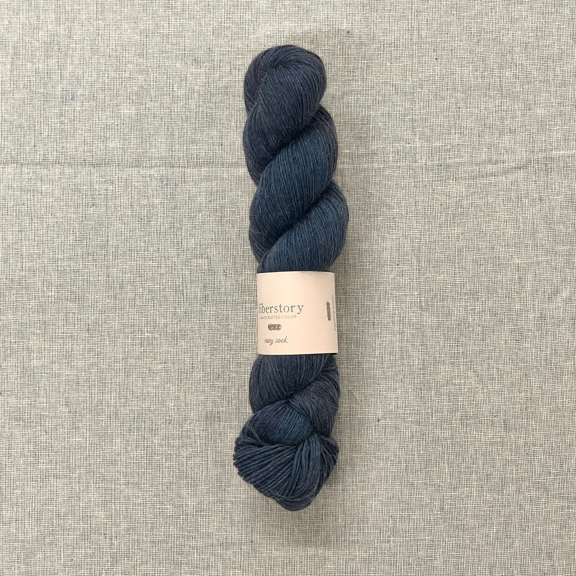 Here is an optimized title for the e-commerce product:

Luxurious Fiberstory Cozy Sock Yarn - Soft, Durable, Hand-Dyed Wool Blend for Knitting & Crochet