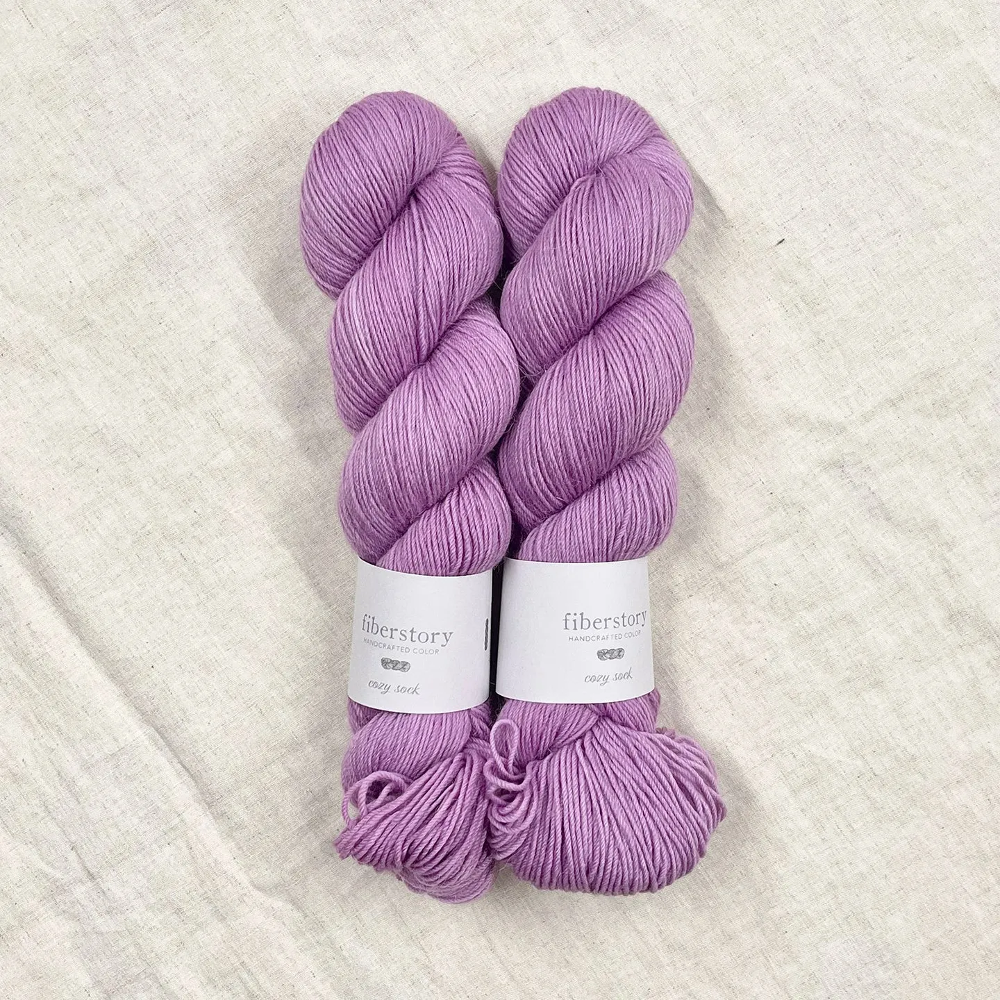 Here is an optimized title for the e-commerce product:

Luxurious Fiberstory Cozy Sock Yarn - Soft, Durable, Hand-Dyed Wool Blend for Knitting & Crochet