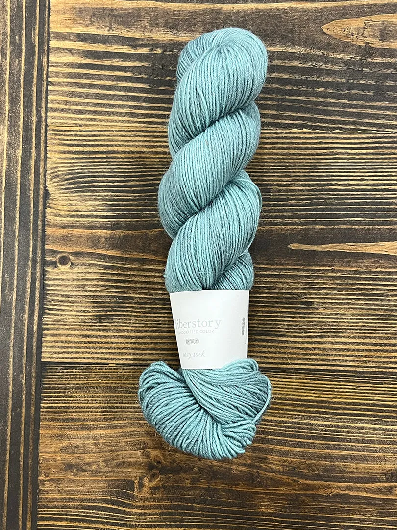 Here is an optimized title for the e-commerce product:

Luxurious Fiberstory Cozy Sock Yarn - Soft, Durable, Hand-Dyed Wool Blend for Knitting & Crochet