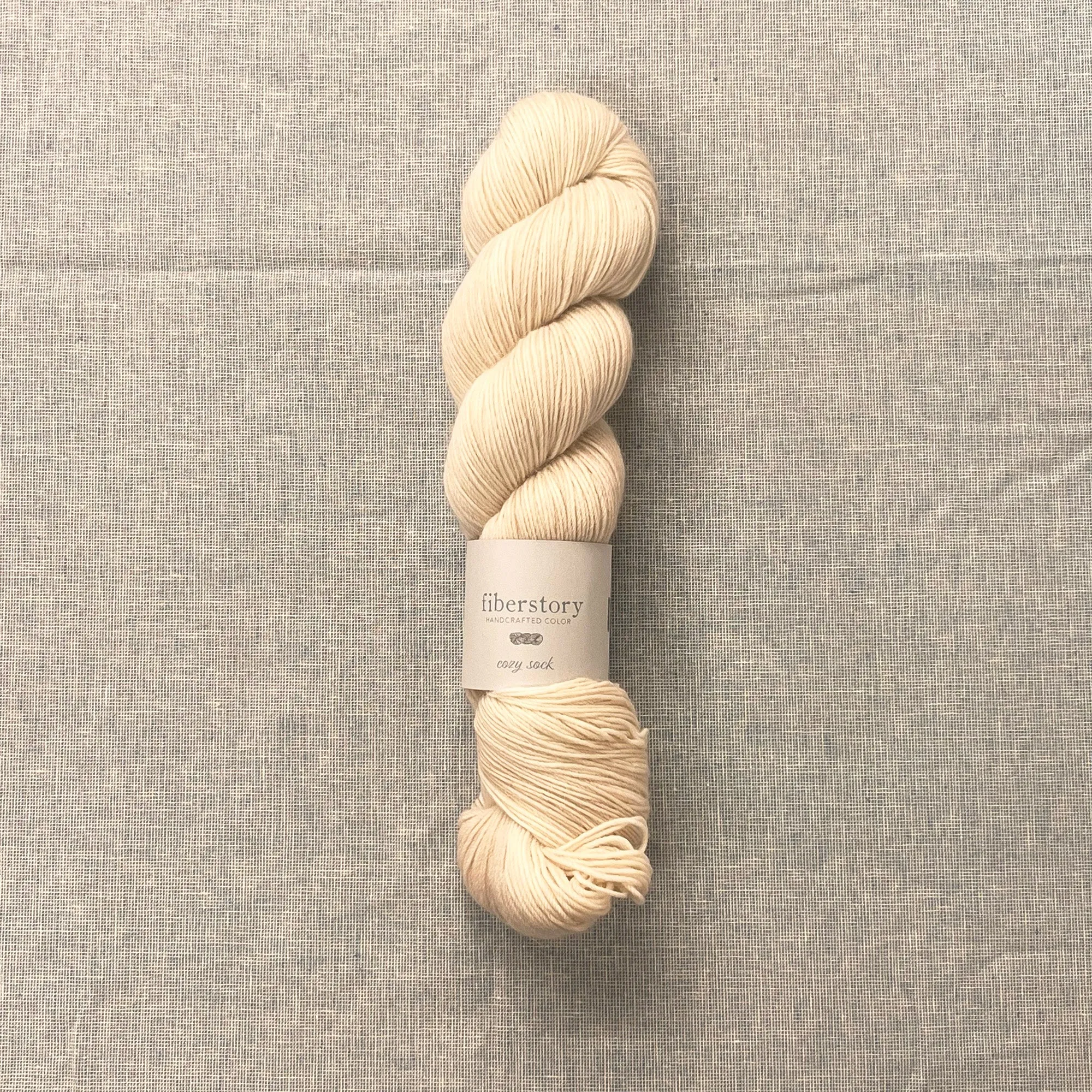 Here is an optimized title for the e-commerce product:

Luxurious Fiberstory Cozy Sock Yarn - Soft, Durable, Hand-Dyed Wool Blend for Knitting & Crochet