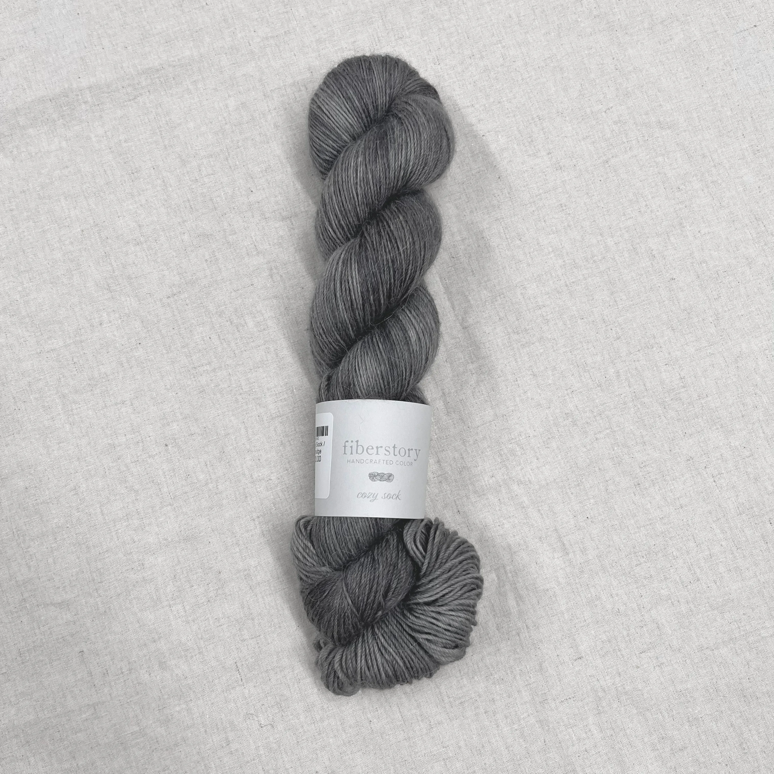 Here is an optimized title for the e-commerce product:

Luxurious Fiberstory Cozy Sock Yarn - Soft, Durable, Hand-Dyed Wool Blend for Knitting & Crochet