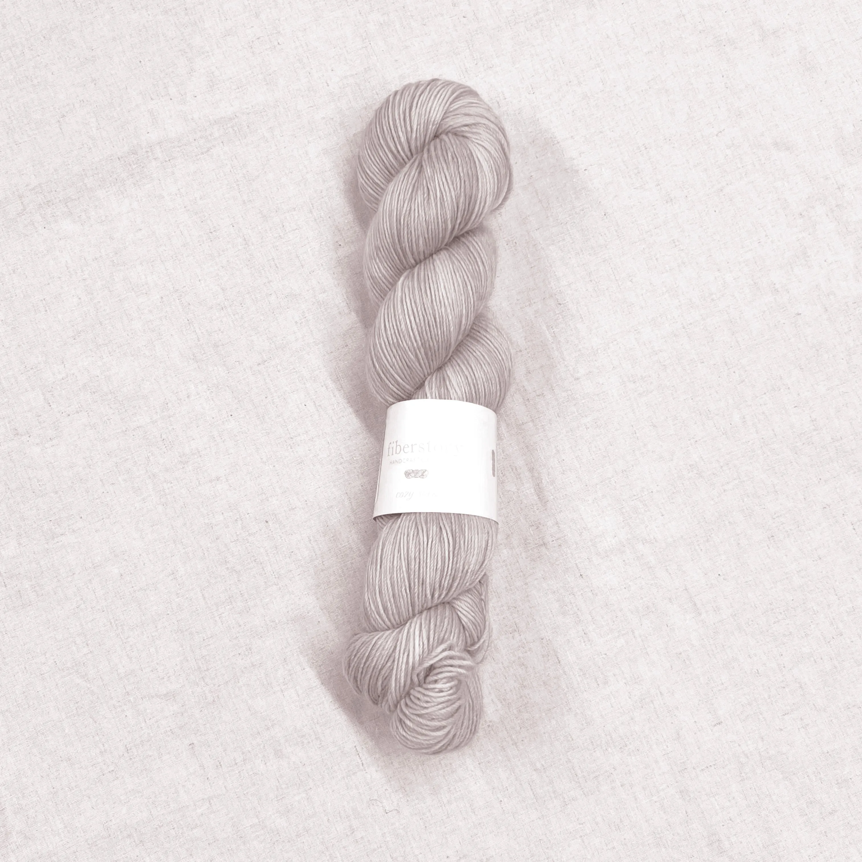 Here is an optimized title for the e-commerce product:

Luxurious Fiberstory Cozy Sock Yarn - Soft, Durable, Hand-Dyed Wool Blend for Knitting & Crochet