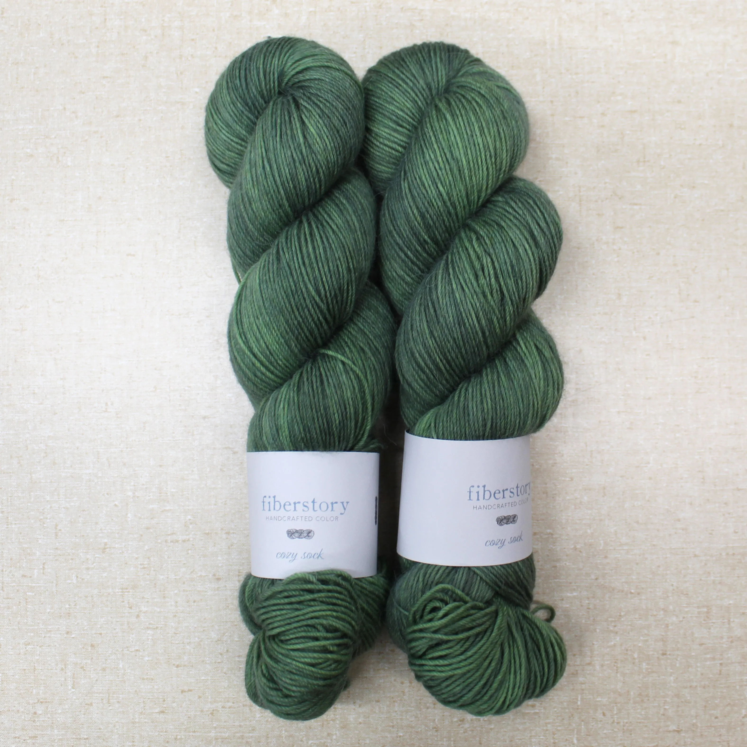 Here is an optimized title for the e-commerce product:

Luxurious Fiberstory Cozy Sock Yarn - Soft, Durable, Hand-Dyed Wool Blend for Knitting & Crochet