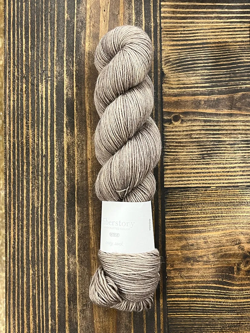 Here is an optimized title for the e-commerce product:

Luxurious Fiberstory Cozy Sock Yarn - Soft, Durable, Hand-Dyed Wool Blend for Knitting & Crochet