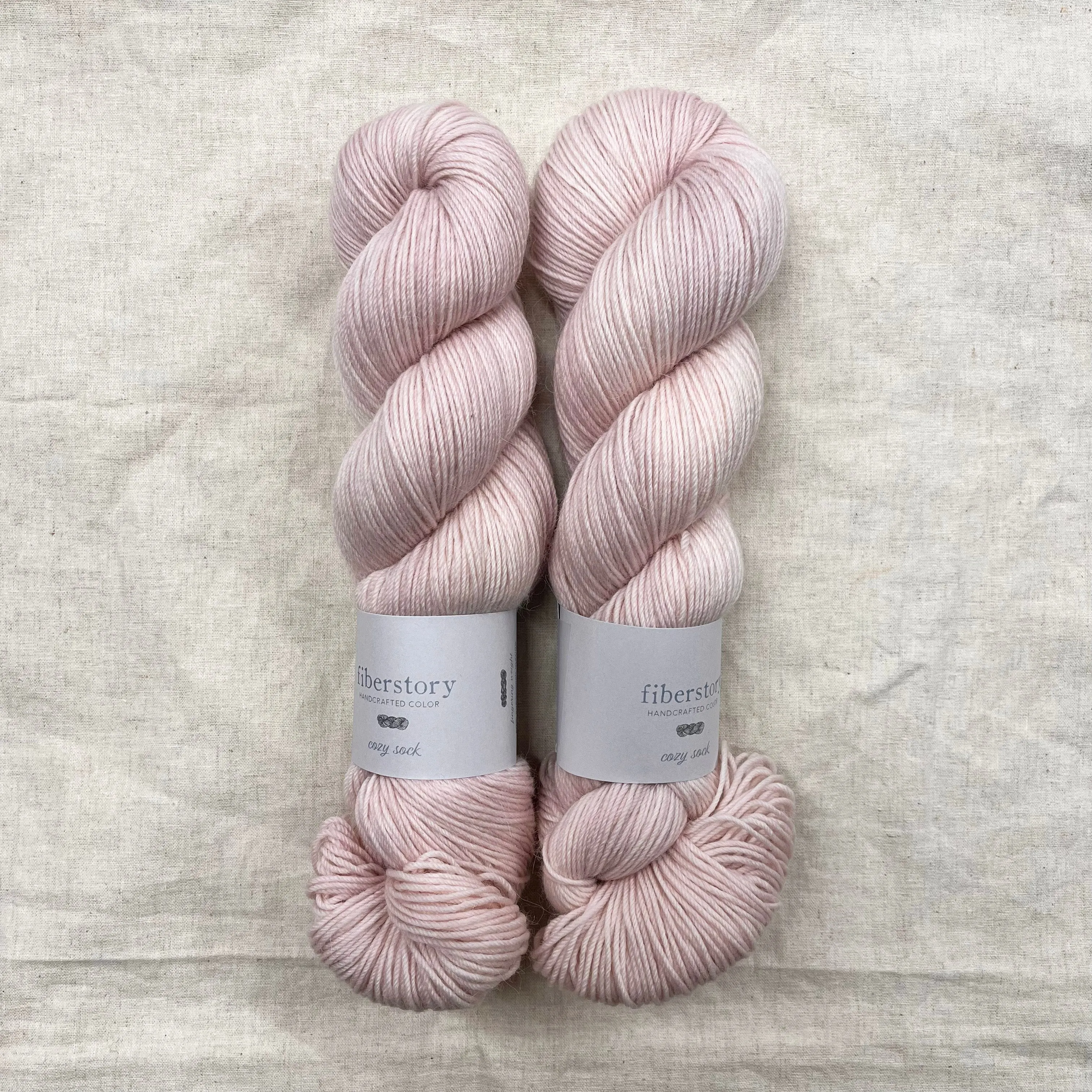 Here is an optimized title for the e-commerce product:

Luxurious Fiberstory Cozy Sock Yarn - Soft, Durable, Hand-Dyed Wool Blend for Knitting & Crochet