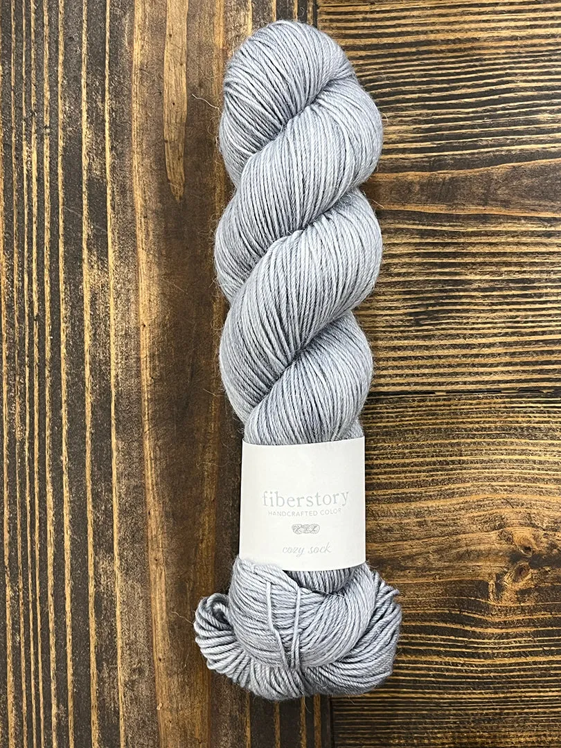 Here is an optimized title for the e-commerce product:

Luxurious Fiberstory Cozy Sock Yarn - Soft, Durable, Hand-Dyed Wool Blend for Knitting & Crochet