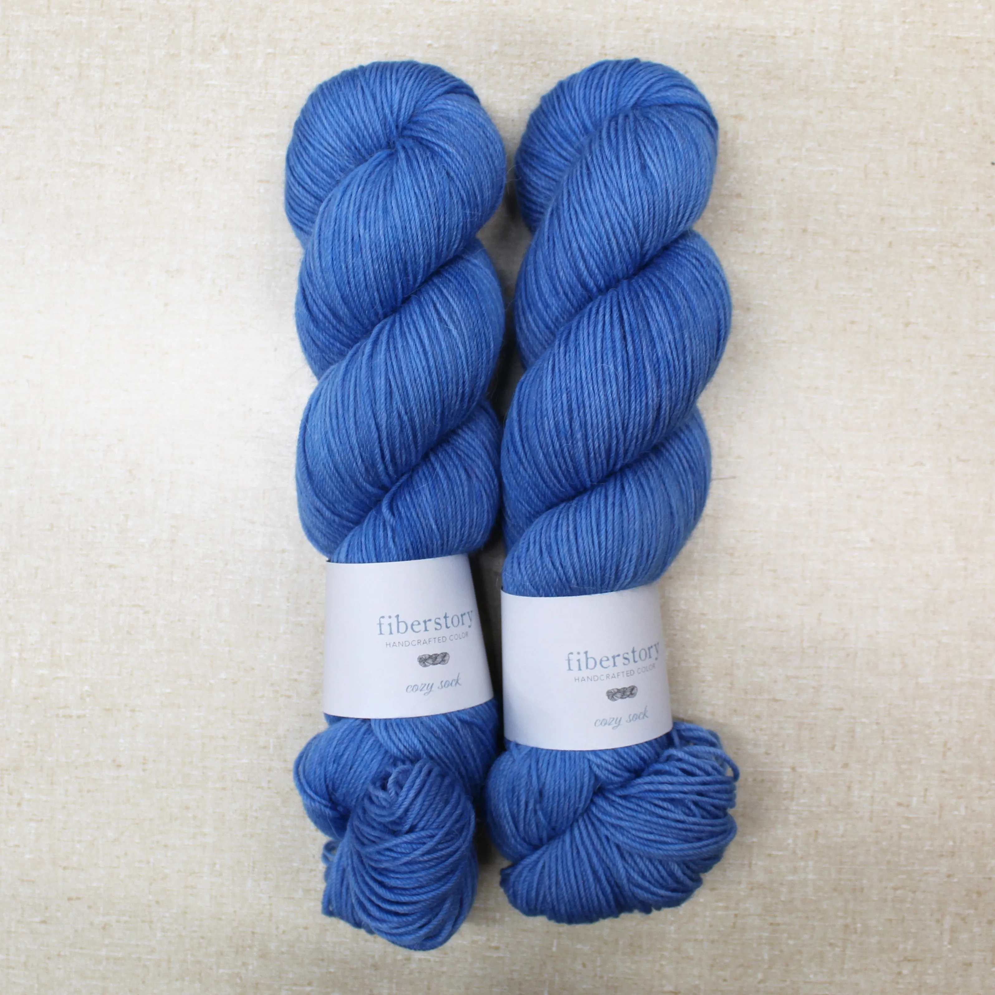 Here is an optimized title for the e-commerce product:

Luxurious Fiberstory Cozy Sock Yarn - Soft, Durable, Hand-Dyed Wool Blend for Knitting & Crochet